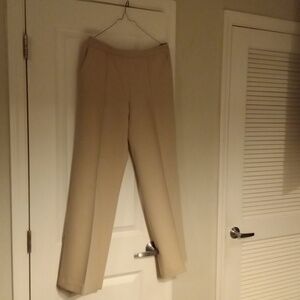 Cream colored side zipper dress pants never worn.